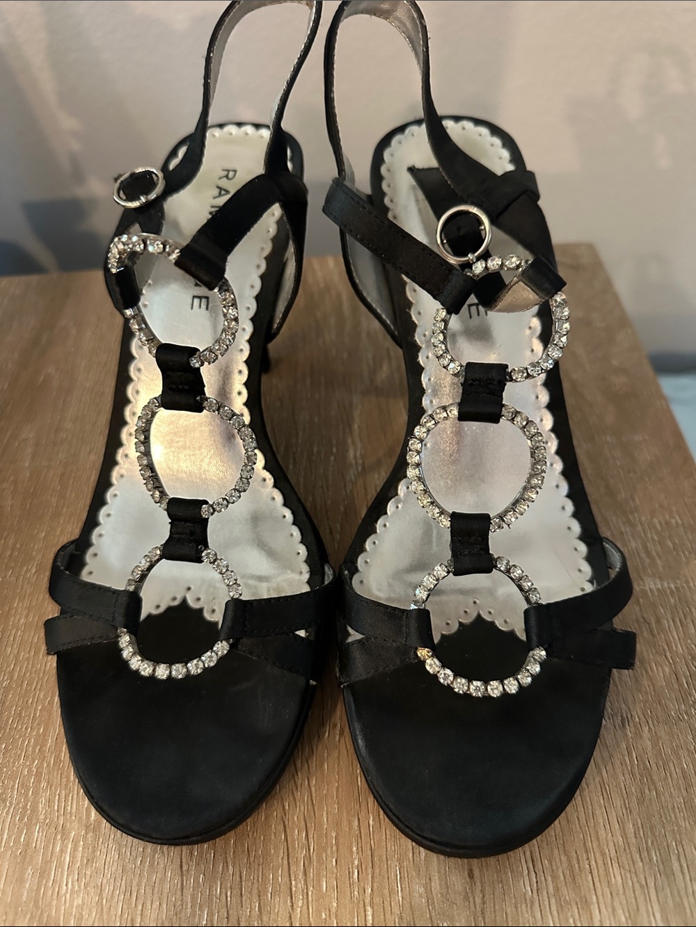 Rampage crystal loops on a black satin heel. Size 9. Open toe, back strap.